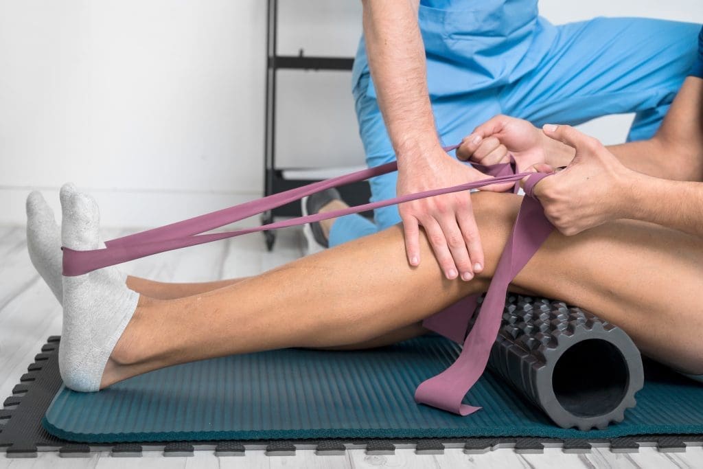 Man using a resistance band for exercise.