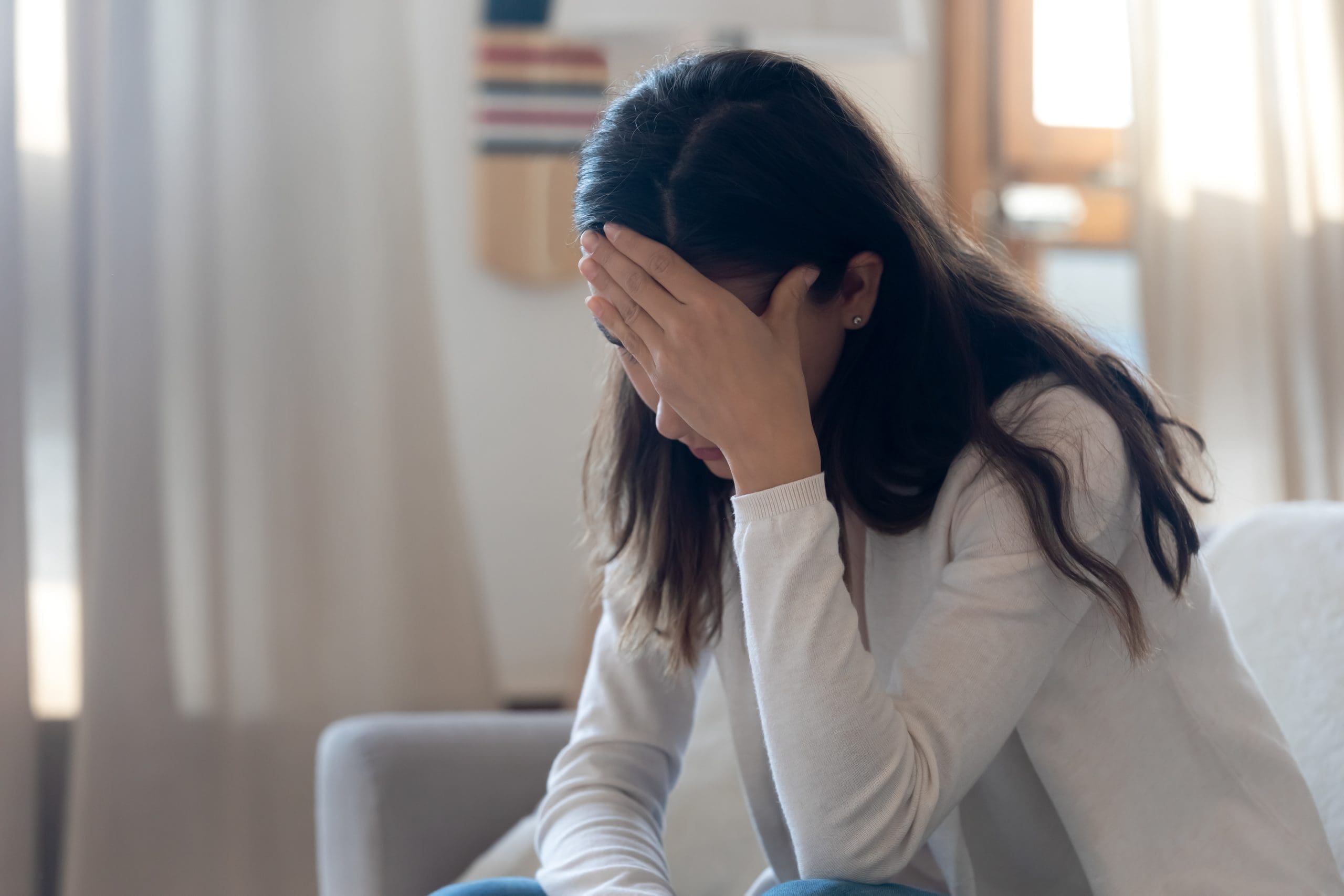 a woman suffering headaches