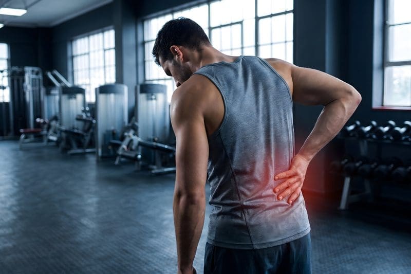 A man having back pain after working out.
